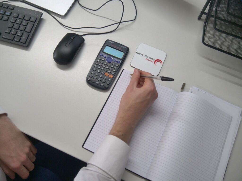 Inheritance Tax Services in Portsmouth - HT Advisory Staff Member Writing On Notepad